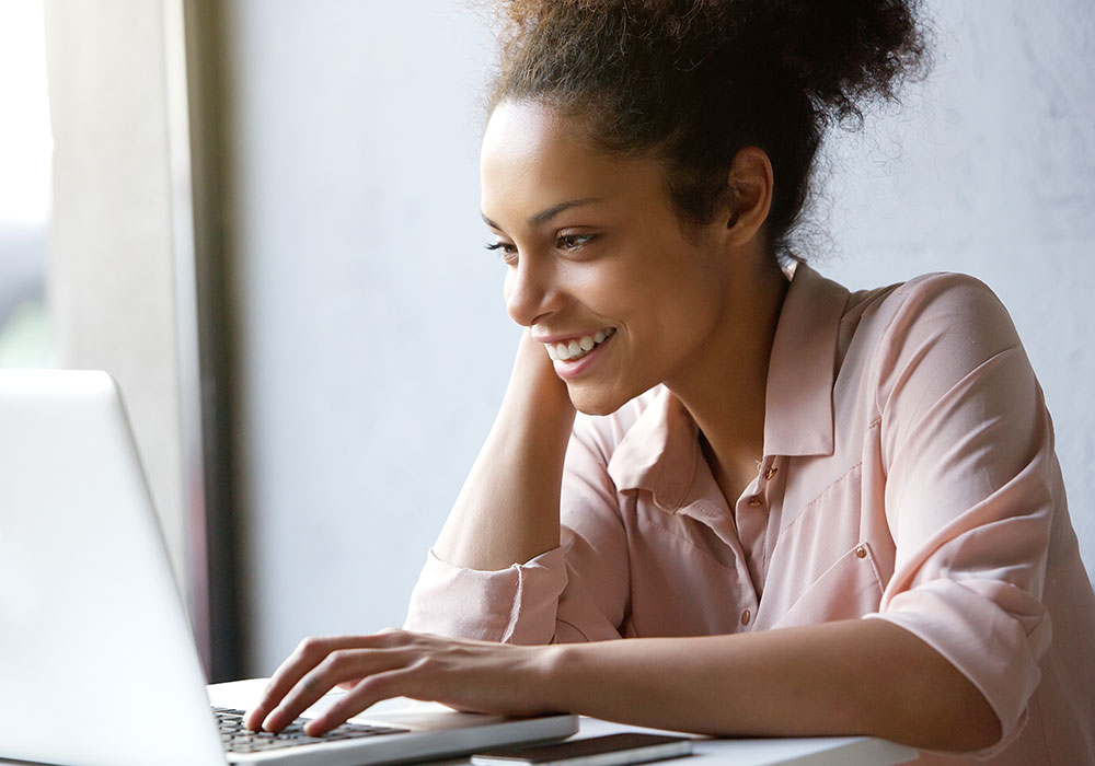 woman looking at laptop computer