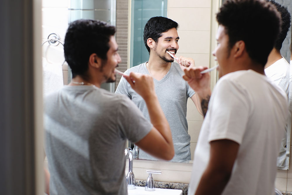 Gay couple brushing their teeth